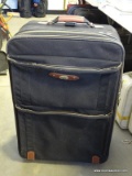LARGE AMERICAN TOURISTER CLOTH ROLLING LUGGAGE.