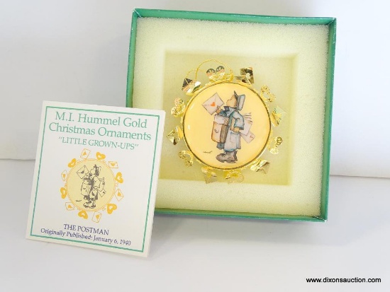 HUMMEL "LITTLE GROWN-UPS" GOLD CHRISTMAS ORNAMENT. THE POSTMAN. 2.5" ACROSS. IN THE ORIGINAL BOX.