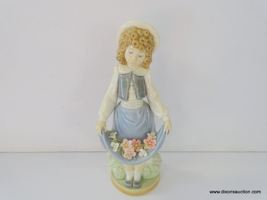 NAO BY LLADRO COLEGIALA CON FLORES. ITEM# 1.005. 8" TALL. IN THE ORIGINAL BOX.