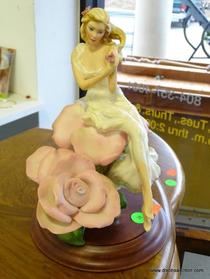 (SEC A) FRANKLIN MINT PORCELAIN LADY ROSE FIGURINE (1988) ON WOODEN STAND: 8"x11". IN EXCELLENT