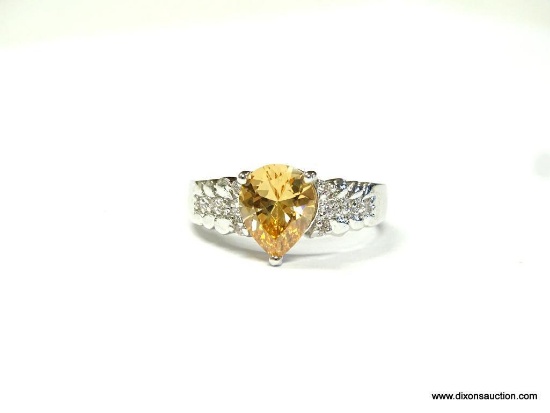 LADIES .925 STERLING SILVER RING WITH BEAUTIFUL ORANGE CITRINE CENTER STONE. THIS RING IS AN APPROX.