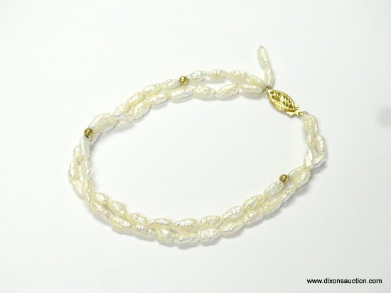 LADIES DOUBLE STRAND FRESH WATER RICE PEARL BRACELET WITH 14KT YELLOW GOLD CLASP & BALLS. THE CLASP