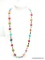 LONG BRIGHTLY COLORED SHELL DECORATED NECKLACE. 40