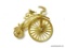 ANTIQUE BICYCLE THEMED GOLD TONE BROOCH/PIN. HAS LARGE MOVING FRONT WHEEL. 2