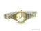 LADIES FOSSIL TWO TONE STAINLESS STEEL QUARTZ WATCH. MODEL# ES-9260. HAS A DIAMOND CUT FACETED