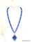 VINTAGE SIGNED TRIFARI BLUE AND GOLD TONE DROP PENDANT BEAD NECKLACE. 27