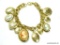 Very Nice Cameo & Locket Gold Tone Charm Bracelet. Measures 7.25