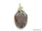 SILVER WIRE WRAPPED OVAL JASPER STONE SIGNED ON THE BACK WITH A NATIVE AMERICAN MARK. 2.5