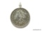 1879 Morgan silver dollar set in a silver bezel this is a nice coin and it can be taken out if
