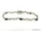 DESIGNER SILVER TONE LINK BRACELET SET WITH 5 DARK BLUE SAPPHIRES. HAS A DOUBLE SAFETY CLASP TO