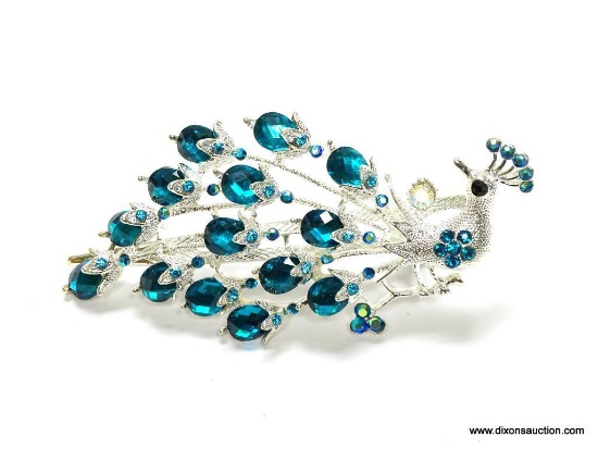 BEAUTIFUL LARGE PEACOCK HAIR CLIP SET WITH FACETED BLUE STONES. THIS PIECE IS BEAUTIFUL AND COULD BE