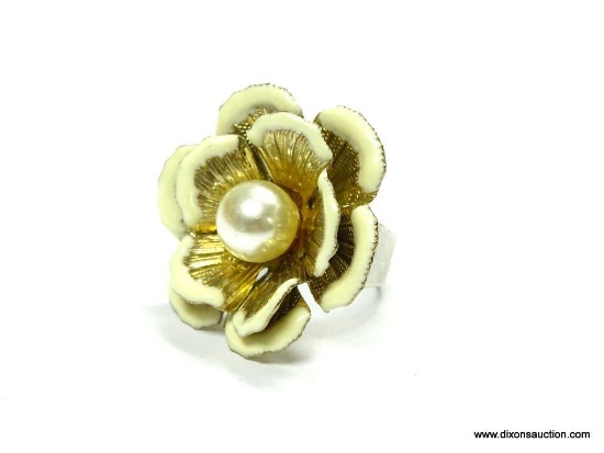 VINTAGE FLOWER SHAPED CONVERSATION RING SIZE 5.5. FLOWER 1.25" ACROSS. HAS A FAUX PEARL IN THE