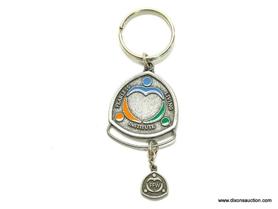PEWTER FINISH ENAMEL DECORATED I AM FEARLESS KEYCHAIN WITH ATTACHED CHARM. 3.5" LONG. A GREAT