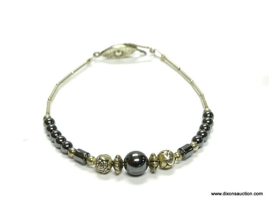 VINTAGE LIQUID SILVER AND HEMATITE BRACELET. 8" LONG. IN GOOD CONDITION.
