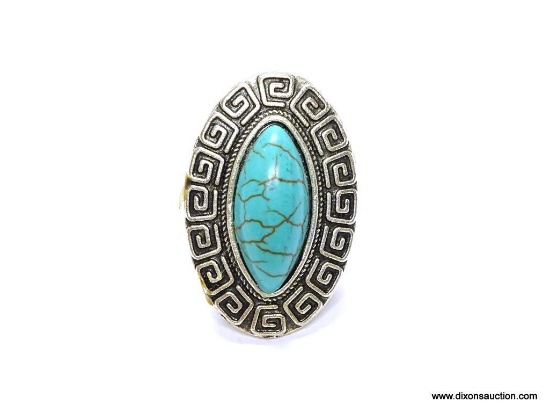 VINTAGE TURQUOISE STYLE RING. CENTER STONE SURROUNDED BY GREEK KEY DESIGN. RING TOP 1.5" LONG. THIS