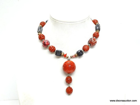 VINTAGE CARVED CINNABAR ROUND BALL OF LIFE DROP PENDANT NECKLACE. 17" LONG. PENDANT HAS 3" DROP.