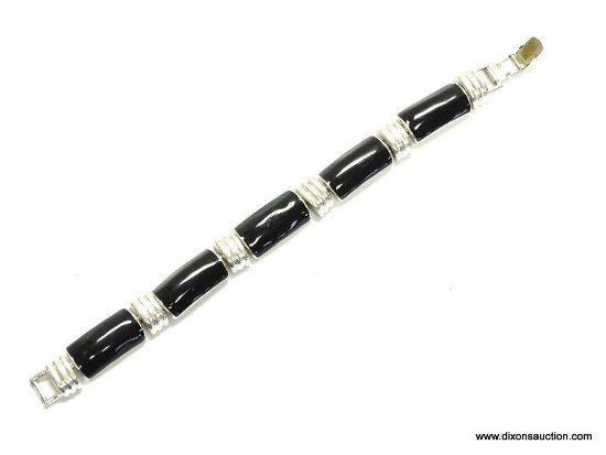 NAPIER QUALITY BLACK ONYX AND SILVER TONE LINK BRACELET. 7" LONG. APPROX. .5" WIDE. IN VERY GOOD