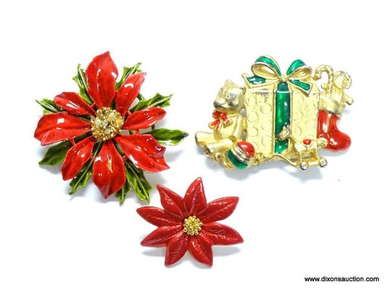 LOT OF 3 CHRISTMAS BROOCHES/PINS. INCLUDES A BEAUTIFUL AVON POINSETTIA PIN, A CHRISTMAS PRESENT