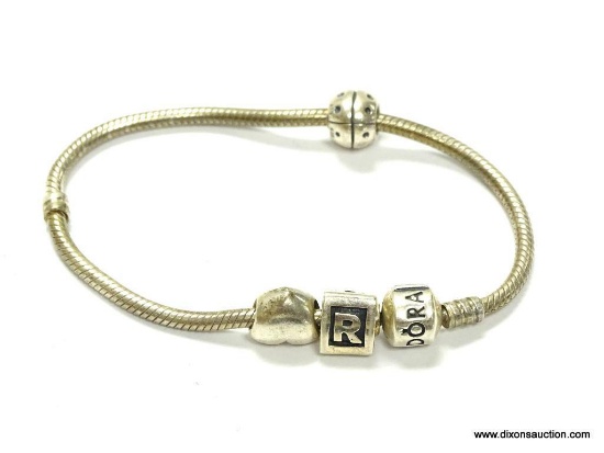 Authentic Pandora sterling silver bracelet with charms measure 7.25 in long does needs a little