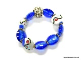 ART GLASS BEAD EXPANSION/STRETCH BRACELET. 1 SIZE FITS ALL. DECORATED WITH COBALT BLUE BEADS AND