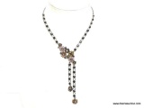 VERY NICE FLORAL THEMED RHINESTONE AND ENAMEL DECORATED NECKLACE WITH DROP TASSELS. HANG TAG IS