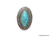 VINTAGE TURQUOISE STYLE RING. CENTER STONE SURROUNDED BY GREEK KEY DESIGN. RING TOP 1.5