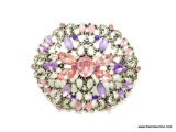 SILVER TONE BROOCH SET WITH PURPLE AND PINK STONE. 2 1/8