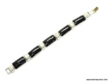 NAPIER QUALITY BLACK ONYX AND SILVER TONE LINK BRACELET. 7