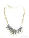 VERY NICE BLUE ATOMIC CRYSTAL GOLD TONE NECKLACE. HAS 11 BLUE CRYSTALS. 19