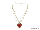 VERY COLLECTIBLE SIGNED BETSY JOHNSON DESIGNER HEART GOLD TONE NECKLACE. FEATURES 3 DIFFERENT GOLD