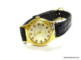 VERY NICE LADIES ADOLFO SWISS MOVEMENT QUARTZ WATCH. HAS PRONG SET RUBY MARKERS. MODEL# 8865.