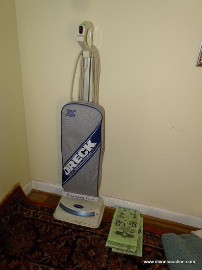 (LR) ORECK XL 2 VACUUM WITH SOME EXTRA BAGS. GOOD CONDITION.