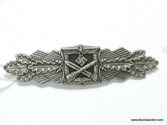 German World War II Army Silver Close Combat Clasp. The reverse side is maker marked "Fec W E