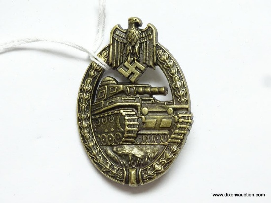 German World War II Army Bronze Tank Assault Badge. The reverse side is maker marked "HA". Has a