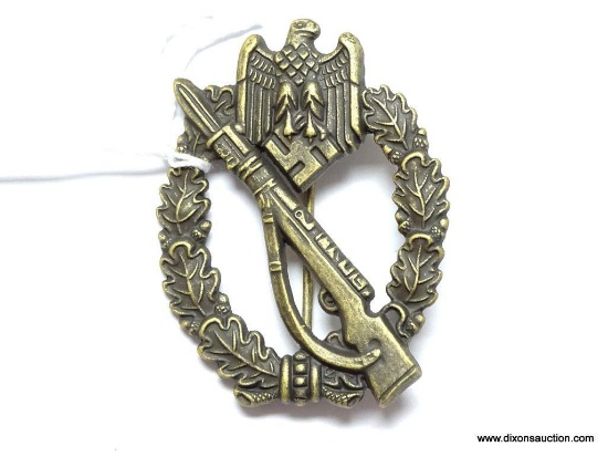 German World War II Army Bronze Infantry Assault Badge. The reverse side is maker marked "SHuCo 41".