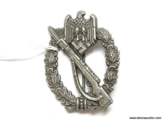 German World War II Army Silver Infantry Assault Badge. The reverse side is maker marked "SHuCo 41".