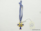 German World War II Gold Mothers Cross. Includes the issue ribbon. Two piece brass construction with