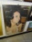 (BACK WALL) FRAMED AND MIRROR MATTED DIANA ROSS ADVERTISING POSTER IN SILVER FRAME: 24.25