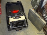 (TABLES) TYPEWRITER IN CASE. INCLUDES A SAMSONITE HARD VINYL SUITCASE AND A CASSETTE TAPE CADDY