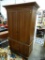 (ROW 2) WALNUT ENTERTAINMENT CABINET. THIS PIECE CAN BE USED FOR A VARIETY OF THINGS! IT COULD BE AN