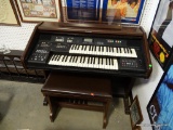 (ROW 1) TECHNICS ELECTRONIC ORGAN IN MAHOGANY CASE WITH MATCHING STOOL. HAS SHEET MUSIC STAND. THIS