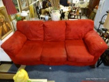 (ROW 1) RED SUEDE 3 CUSHION SOFA. IS IN VERY GOOD USED CONDITION: 89