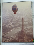 (ROW 1) FRAMED PRINT OF A HOT AIR BALLOON OVERLOOKING PARIS AND THE EIFFEL TOWER. IN SILVER FRAME: