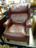 (ROW 3) HANCOCK AND MOORE MAHOGANY AND FAUX LEATHER RECLINING OFFICE CHAIR. HAS BRASS STUDDING ON