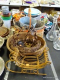 (TABLES) MISC. LOT OF BASKETS. INCLUDES A WICKER SLEIGH AND A TWISTED COPPER STYLE PUMPKIN.