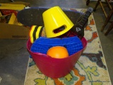 (TABLES) TOTE FILLED WITH CHILDREN'S TOYS: SKATEBOARD. LACROSSE STYLE CATCHERS AND BALL. POOL TOYS.