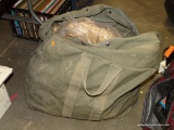 (TABLES) LARGE ARMY GREEN BAG FILLED WITH MISC. CAMOUFLAGE CLOTHING: HATS. GLOVES. AND MORE!