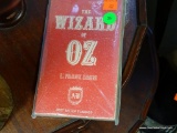 (ROW 1) 1900 EDITION OF THE WIZARD OF OZ. IS IN PROTECTIVE SLEEVE.