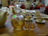 (ROW 1) BOHEMIAN CUT AND AMBER ETCHED DECANTER WITH 4 MATCHING CORDIALS. DECANTER HAS STOPPER: 9