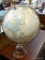(R1) GLOBE OF THE WORLD ON REVOLVING STAND. THIS GLOBE CAN BE TURNED SIDE TO SIDE AND UP AND DOWN TO